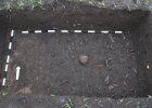 Befund mit Reste von mindestens drei menschlichen Individuen und zahlreichen Tierknochen. 